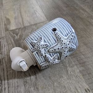 Scentsy wall plug in warmer with costal design.